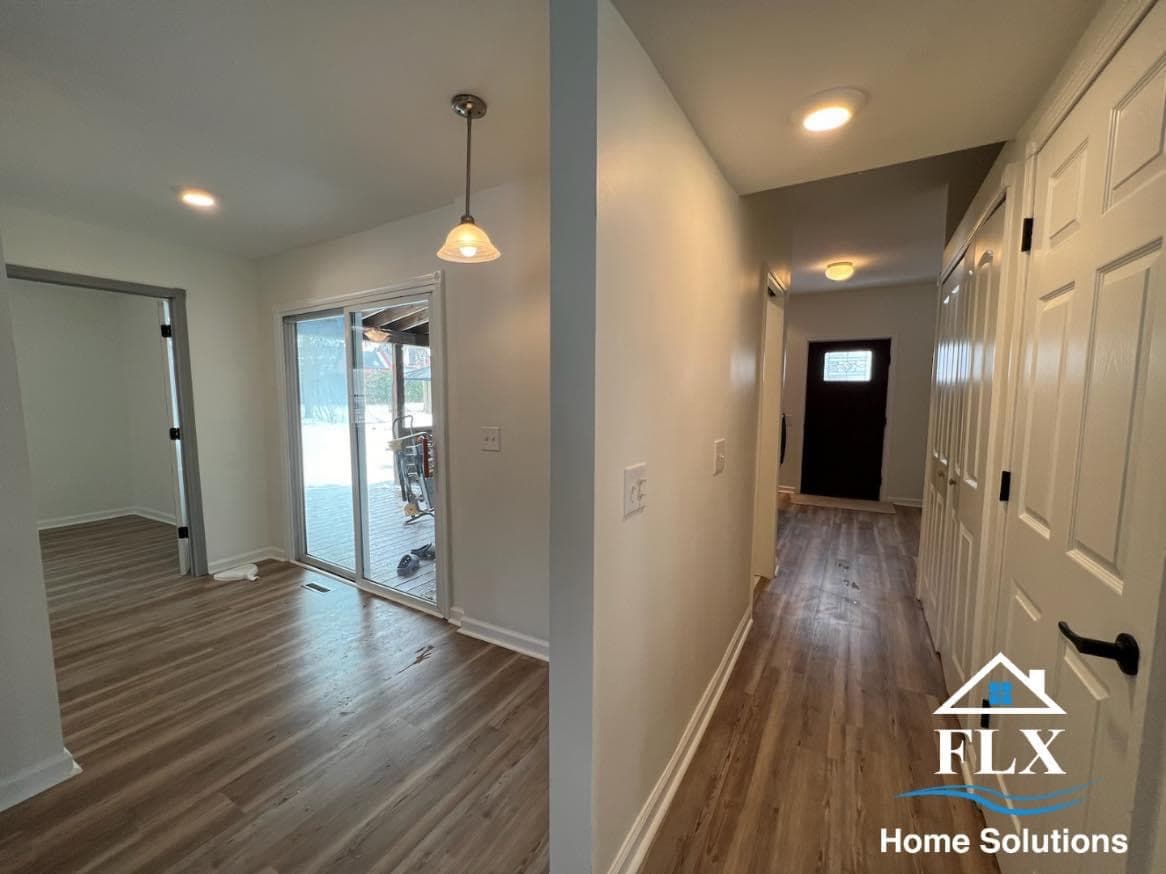 Interior hallway and open space in new home addition with wood flooring