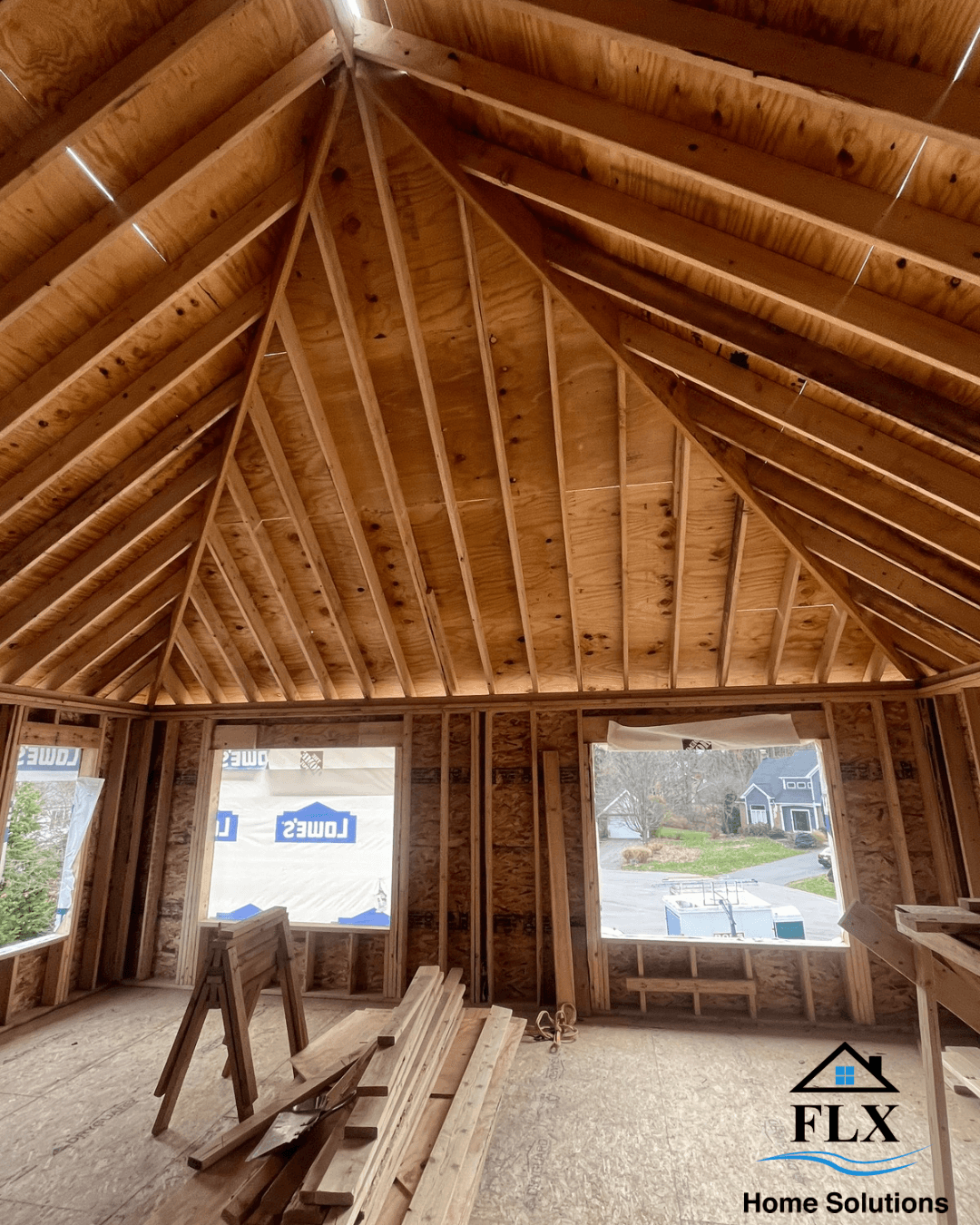 Exposed wood framing of vaulted cathedral ceiling in home addition under construction
