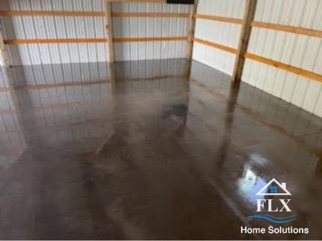 Polished concrete floor in garage with reflective finish and metal wall panels