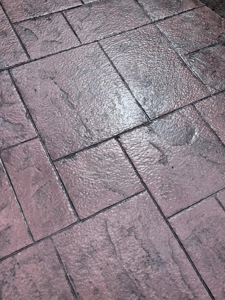 Stamped concrete patio with ashlar slate pattern in gray tones