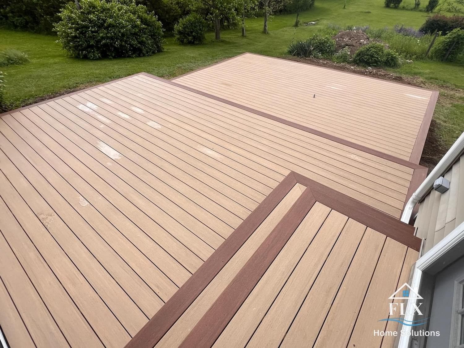 Aerial view of a two-tone composite deck with darker border trim