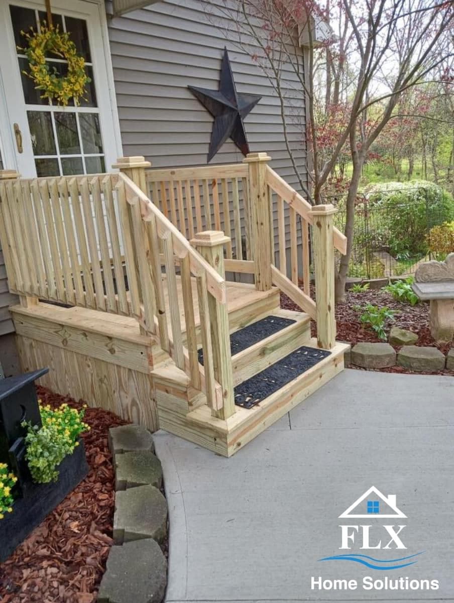 New wooden porch with railings and black star decoration on siding